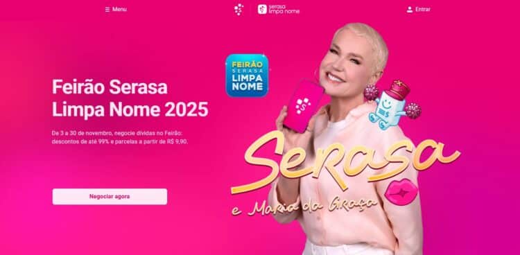 Xuxa Meneghel sorrindo, segurando um celular com o logo Serasa, ao lado da logo "Feirão Limpa Nome" da Serasa em um fundo vibrante de gradiente rosa e roxo.