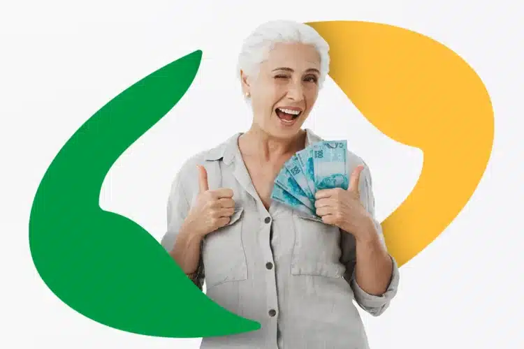 13º do INSS: pagamento para final 2 disponível nesta segunda (27); confira datas oficiais 2 Idosa sorridente com cabelos brancos faz sinal de positivo segurando notas de R$ 100 com logo do INSS.