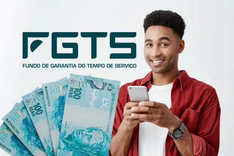 Aniversariantes de maio já têm data para sacar FGTS; confira calendário 1 Jovem de camisa vermelha segura smartphone sorrindo, com notas de R$100 e logotipo do FGTS ao fundo.